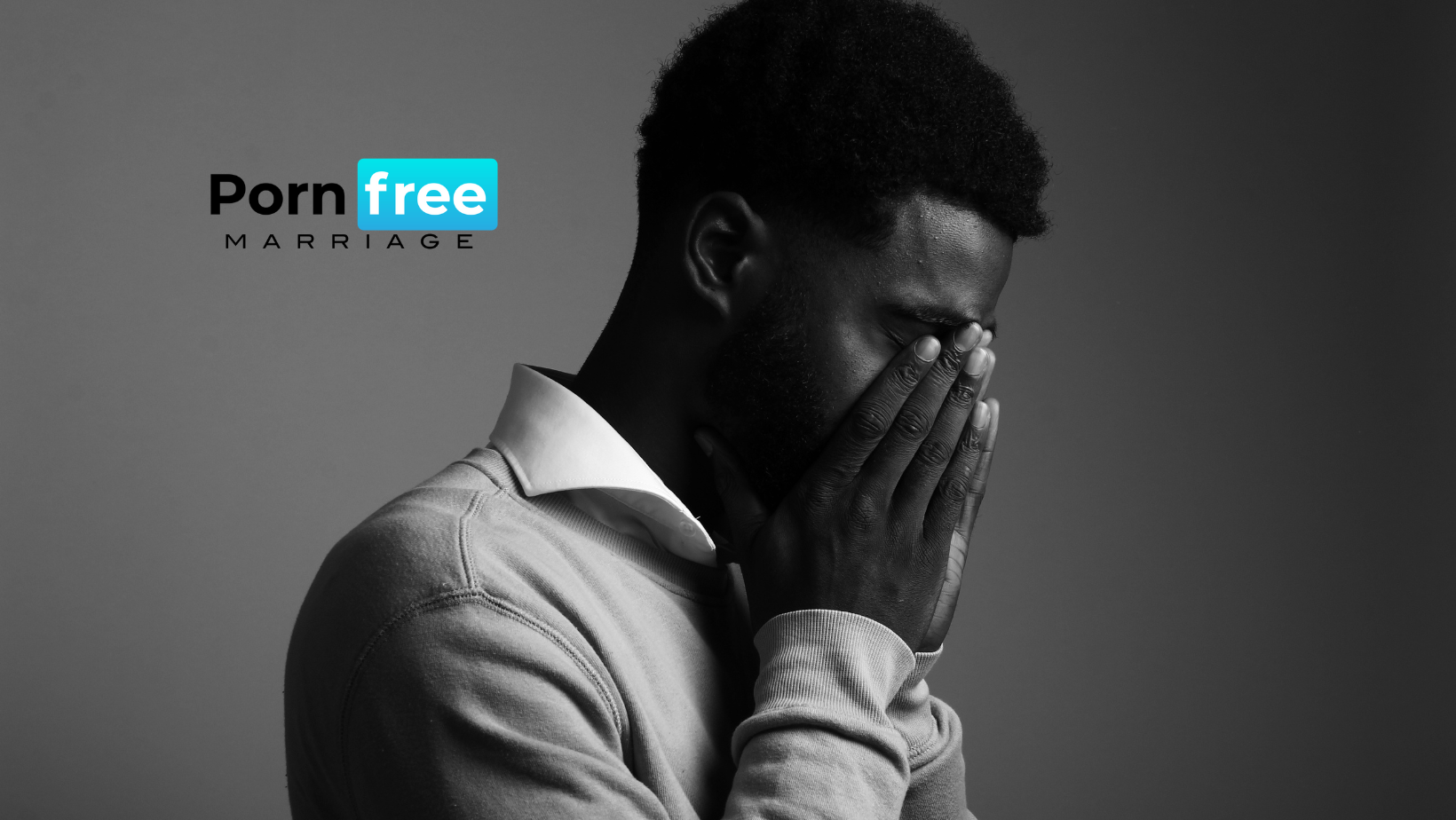 Man with his face in his hand, showing sadness and shame, representing the emotional struggle of porn addiction and the need for recovery.